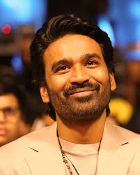 Dhanush showcasing his versatile style and charisma as a renowned Tamil cinema actor